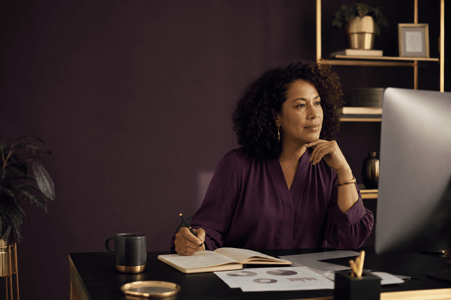 A professional comparing a job description with personal notes