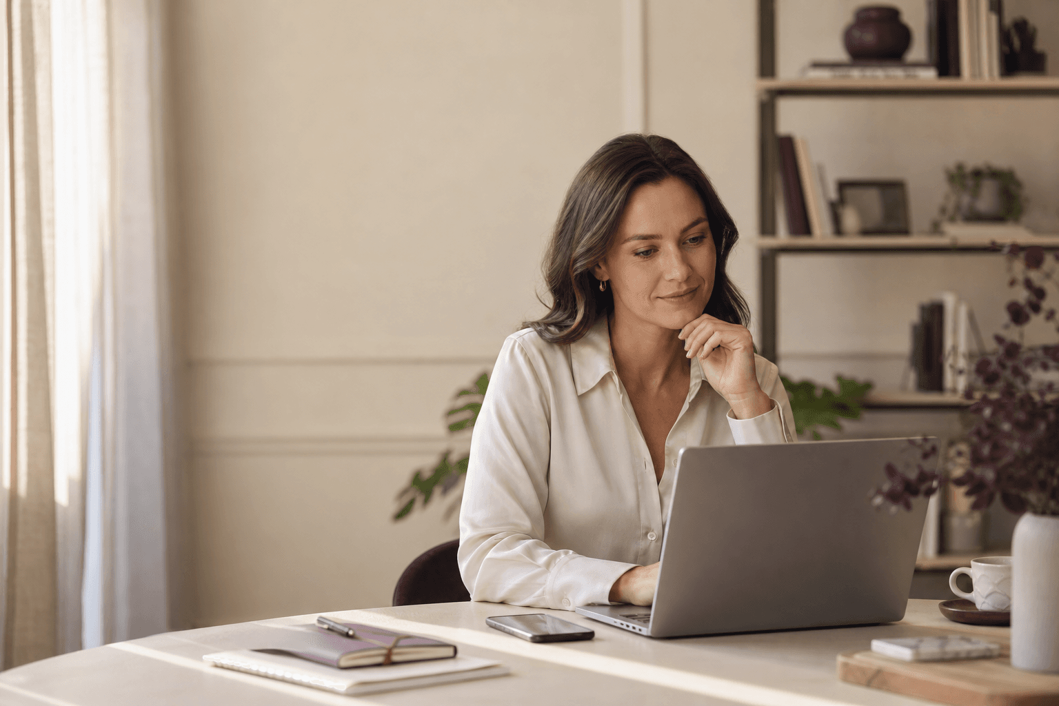 A professional reviewing public market information on a laptop