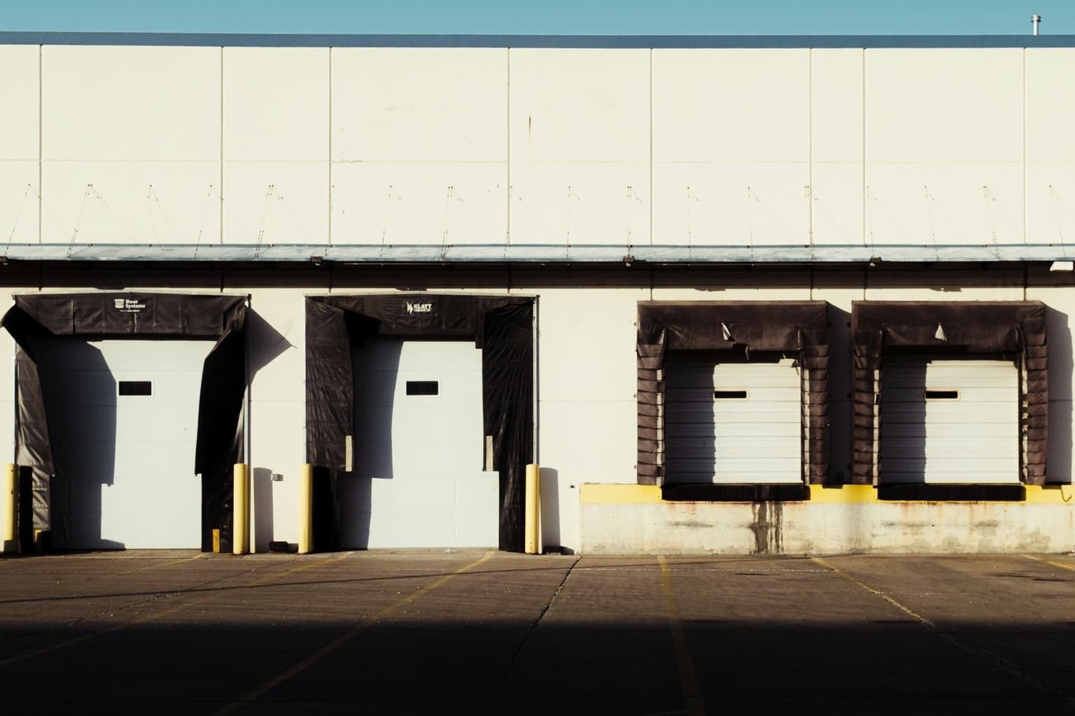 Closed loading dock doors on a commercial distribution building
